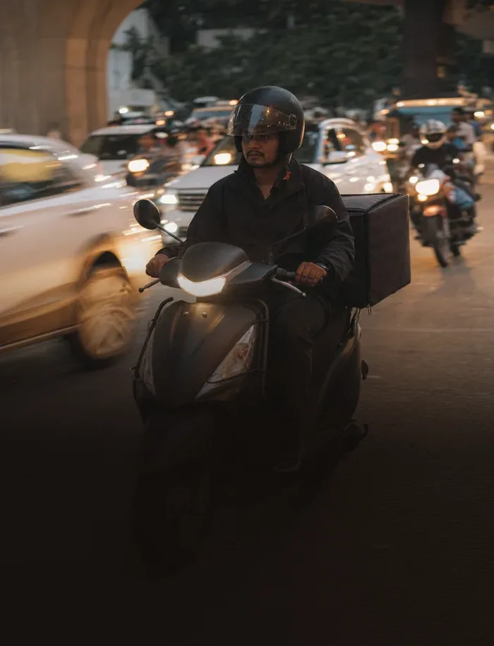 A delivery rider in Bengaluru traffic, for the MobilityHub demand forecasting project